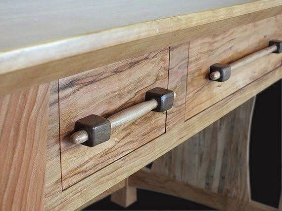 Handcrafted hardwood console with custom drawer pulls